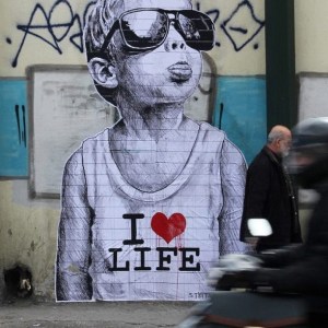 child drawing sticking out tongue wearing shades